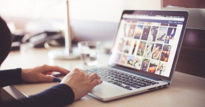 a person looking at a collection of pictures on a laptop