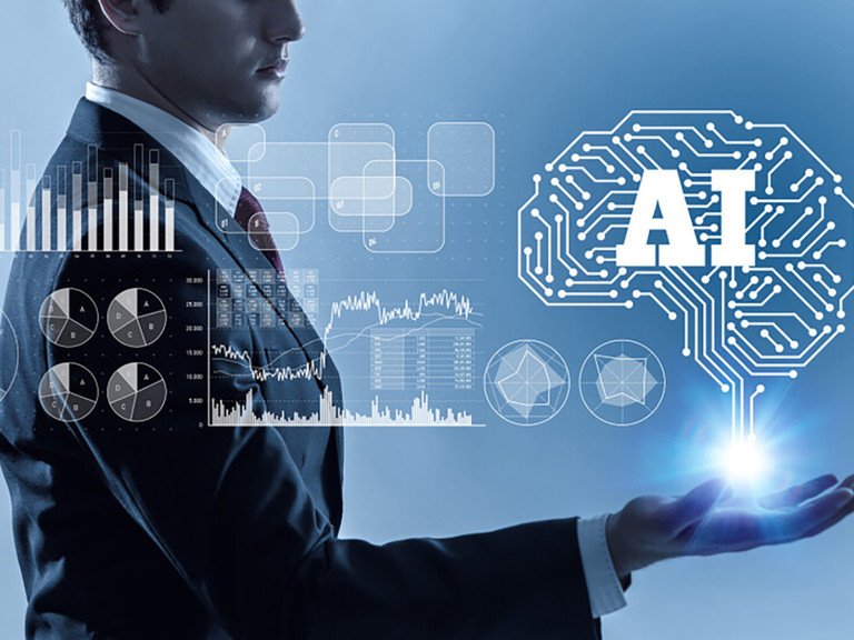 Man in a business suit surrounded by illustrations of graphs and diagrams. Includes a brain shape with the letters AI inside it.