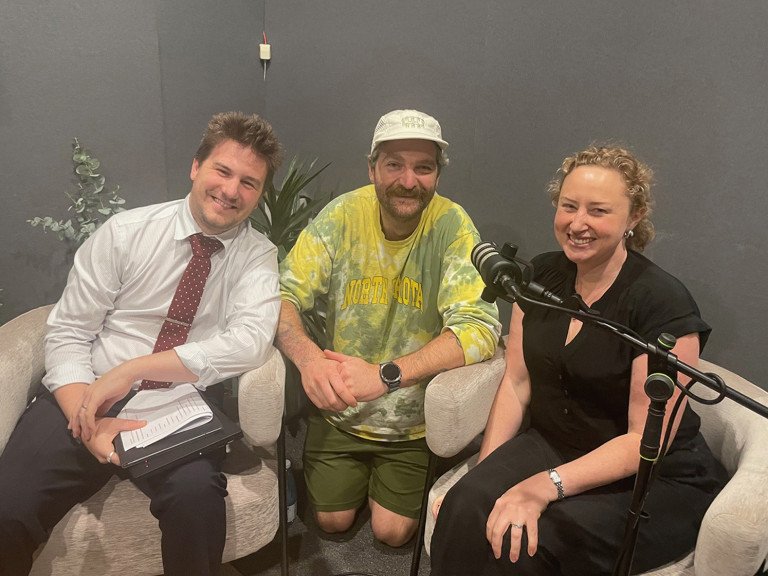 Three businesses people in podcast studio smiling at camera. Josh Underhill from SMART Business Solutions. Sam Keck from Commonfolk Coffee. Genna Monaghan from Arthurs Seat Eagle