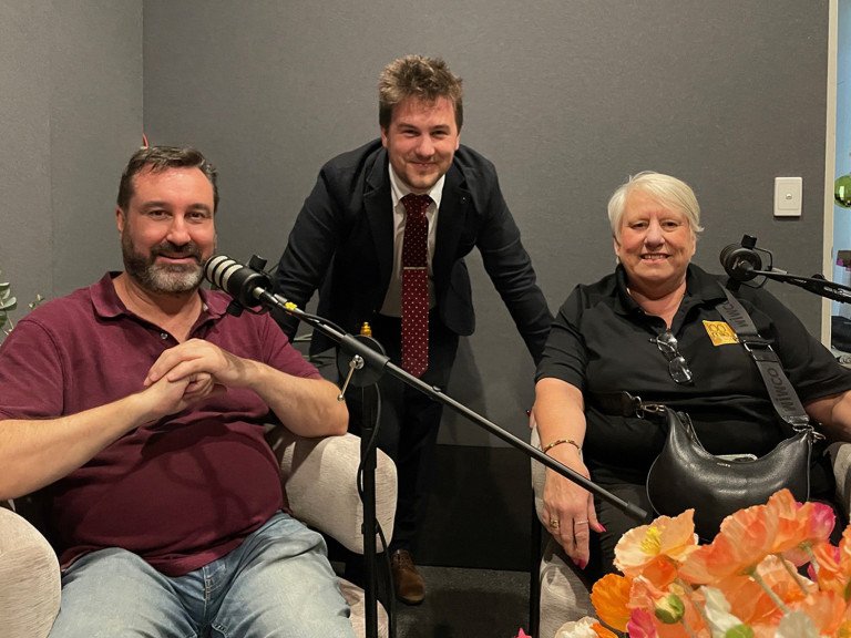 Three businesses people in podcast studio smiling at camera. Jeremy Worthington from Worthington and Associates. Josh Underhill from SMART Business Solutions. Marlene Hoff from 100 Mile Foodie.
